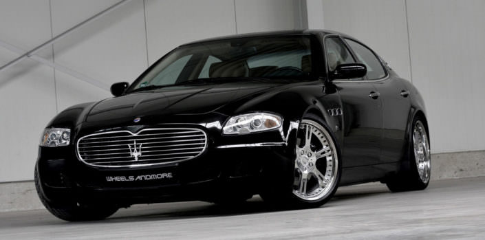 front side view black maserati by wheelsandmore with wheels exhaust and suspension